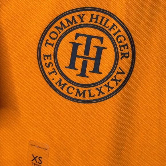 NWT Men’s Tommy Hilfiger Orange With Navy Blue Logo Polo Shirt Size X-Small - Picture 3 of 5